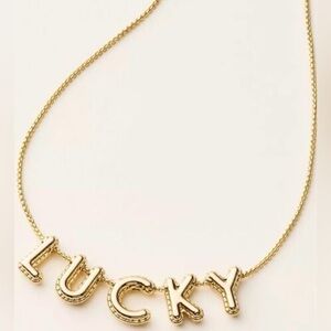 Kate Spade Elegant Gold-Tone Necklace with 'LUCKY' Letters